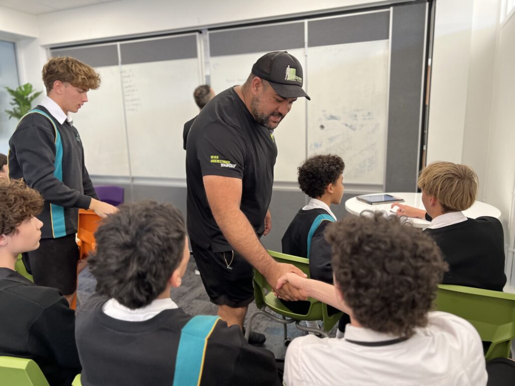 Top Blokes mentoring program - handshake between mentor and young man